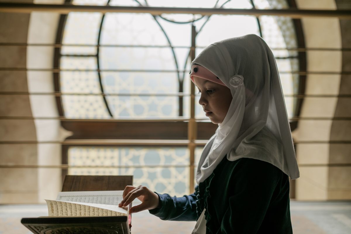 A young learner reading the Quran