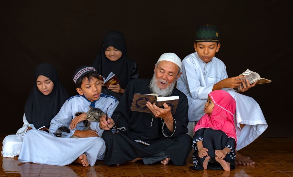 A family reading the Quran together at home